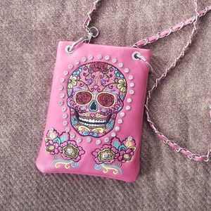 Skull embellished crossbody bag